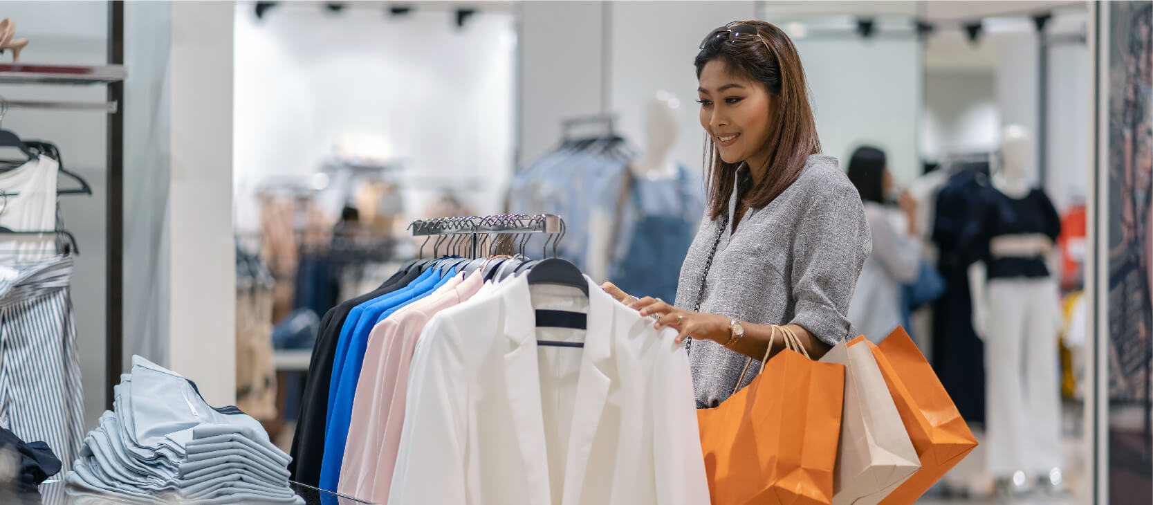 Woman in department store looking at jackets