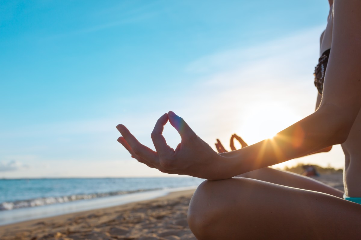 Woman meditating on beach117711484 2
