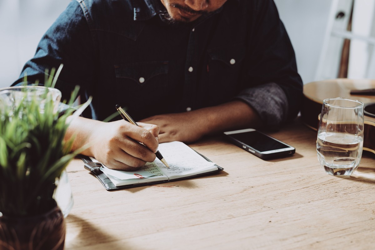 Man works on budget at desk 136626844