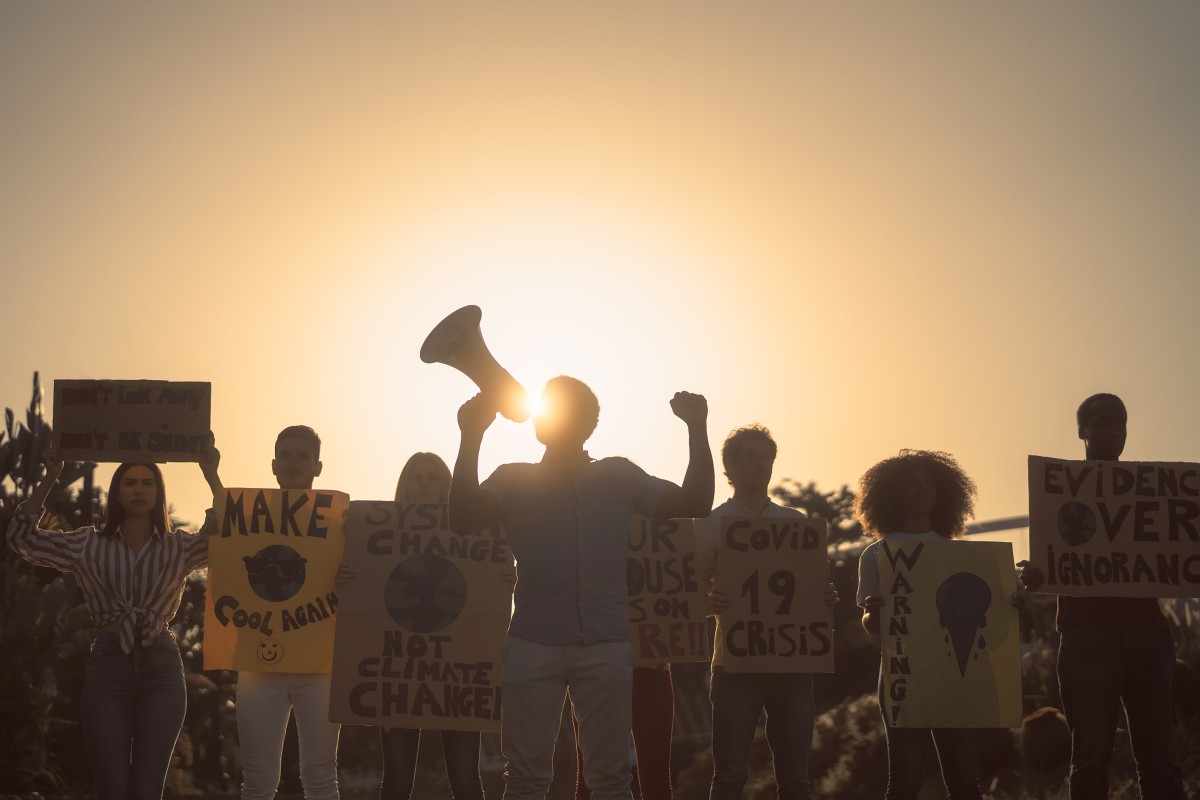 Crowd of Demonstrators with protest signs and a megaphone